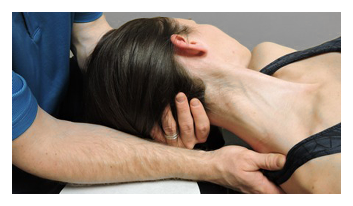 Hands-on fascial release to the neck and upper shoulder
